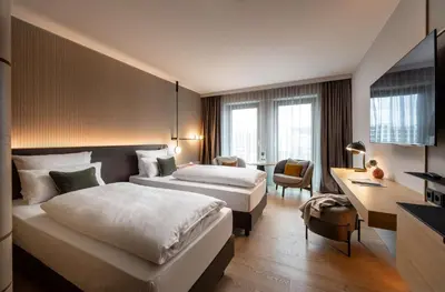 Ein Bett oder Betten in einem Zimmer der Unterkunft ATLANTIC Hotel Heidelberg