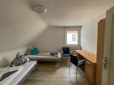 Ein Bett oder Betten in einem Zimmer der Unterkunft Apartments Sülmerstrasse