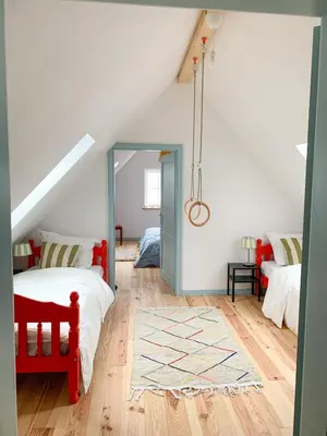 Ein Bett oder Betten in einem Zimmer der Unterkunft Zita Ferienhäuser - Ferienhaus Feni