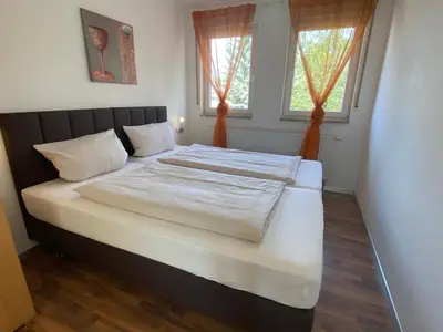 Ein Bett oder Betten in einem Zimmer der Unterkunft Fleiner Gästehaus
