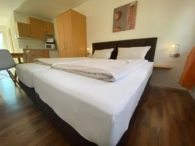 Ein Bett oder Betten in einem Zimmer der Unterkunft Fleiner Gästehaus