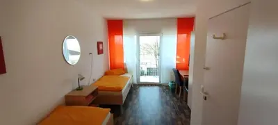 Ein Sitzbereich in der Unterkunft Gaststätte Zur Tribüne
