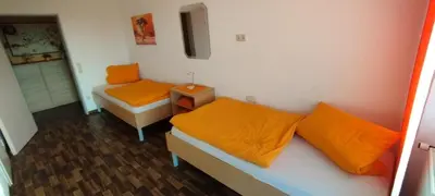 Ein Bett oder Betten in einem Zimmer der Unterkunft Gaststätte Zur Tribüne