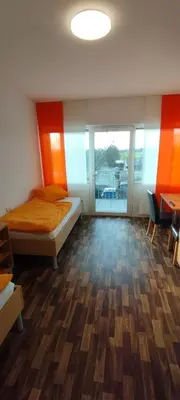 Ein Bett oder Betten in einem Zimmer der Unterkunft Gaststätte Zur Tribüne