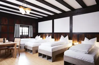 Ein Bett oder Betten in einem Zimmer der Unterkunft Gentilburg und Gärtnerhaus Aschaffenburg