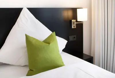 Ein Bett oder Betten in einem Zimmer der Unterkunft RNK Hotel by WMM Hotels