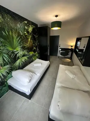 Ein Bett oder Betten in einem Zimmer der Unterkunft EasyLiving Darmstadt