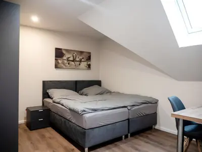 Ein Bett oder Betten in einem Zimmer der Unterkunft Pension HSL