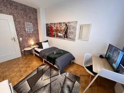 Ein Sitzbereich in der Unterkunft Großes Apartment Aschaffenburg 4 Schlafzimmer bis zu 10 Personen Mainpark Apartment Mainaschaff
