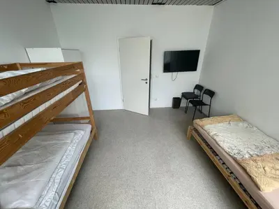 Ein Bett oder Betten in einem Zimmer der Unterkunft Monteursparadies 4 DZ, 2 Bäder, einfach gut