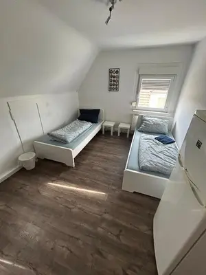 Ein Bett oder Betten in einem Zimmer der Unterkunft Monteurwohnung mit Parkplatz - Besigheim