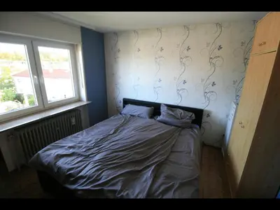 Ein Bett oder Betten in einem Zimmer der Unterkunft NEU! Ferienwohnung im Herzen der Pfalz