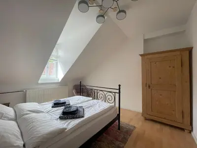 Ein Bett oder Betten in einem Zimmer der Unterkunft Haardter Mandelring