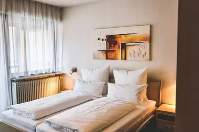 Ein Bett oder Betten in einem Zimmer der Unterkunft Land.Wein.Gut Pension