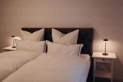 Ein Bett oder Betten in einem Zimmer der Unterkunft Land.Wein.Gut Pension