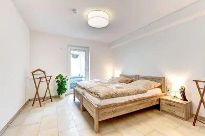 Ein Bett oder Betten in einem Zimmer der Unterkunft Ferienwohnung Am Rehgarten