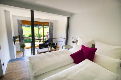 Ein Bett oder Betten in einem Zimmer der Unterkunft Wo der Hahn kräht