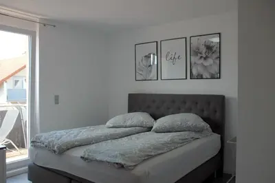 Ein Bett oder Betten in einem Zimmer der Unterkunft Deluxe Appartement