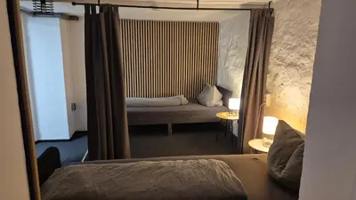 Ein Bett oder Betten in einem Zimmer der Unterkunft Fridolin