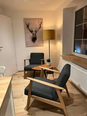 Ein Sitzbereich in der Unterkunft Apartmenthaus Wagner