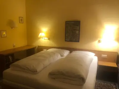 Ein Bett oder Betten in einem Zimmer der Unterkunft Gasthaus Klosterhof