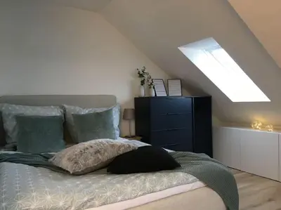 Ein Bett oder Betten in einem Zimmer der Unterkunft Gemütliches Apartment am Kurhaus in Dobel