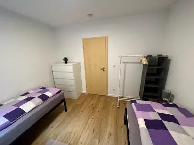 Ein Bett oder Betten in einem Zimmer der Unterkunft Beautiful, large and great apartment with balcony in top location