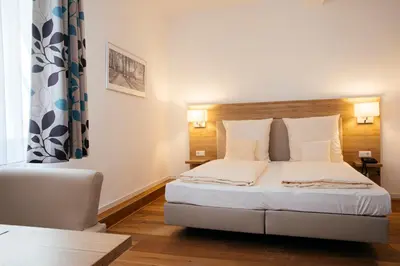 Ein Bett oder Betten in einem Zimmer der Unterkunft Hotel Perkeo