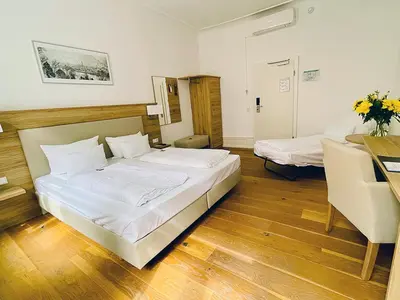 Ein Bett oder Betten in einem Zimmer der Unterkunft Hotel Perkeo