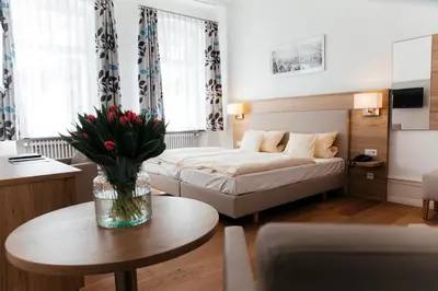 Ein Bett oder Betten in einem Zimmer der Unterkunft Hotel Perkeo
