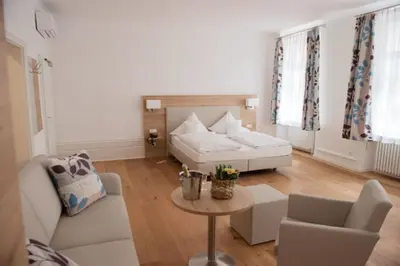 Ein Bett oder Betten in einem Zimmer der Unterkunft Hotel Perkeo