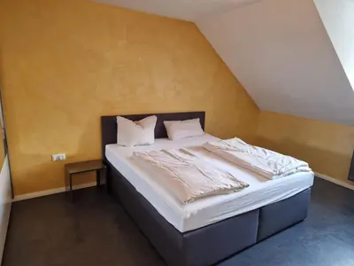 Ein Bett oder Betten in einem Zimmer der Unterkunft Wohnen auf Zeit City Speyer