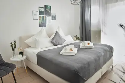 Ein Bett oder Betten in einem Zimmer der Unterkunft Ajko Homes - Design Apartment - Parkplatz - Balkon - Netflix - 6 Pers