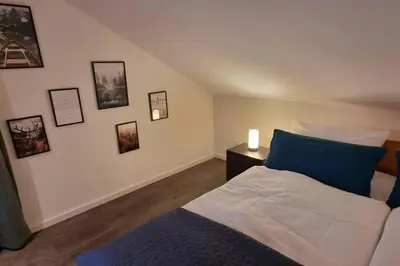 Ein Bett oder Betten in einem Zimmer der Unterkunft Capa Ferienwohnung Pfalz