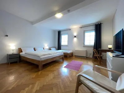 Ein Bett oder Betten in einem Zimmer der Unterkunft Große Maisonette-Wohnung by Rabe - Gartenabteil, Smart-TV, Netflix