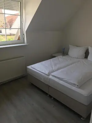 Ein Bett oder Betten in einem Zimmer der Unterkunft Landhaus Kirsch