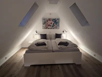 Ein Bett oder Betten in einem Zimmer der Unterkunft Ferienhaus am Park