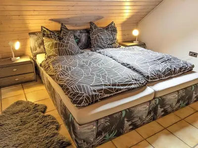 Ein Bett oder Betten in einem Zimmer der Unterkunft Ferienwohnung Madenburgblick