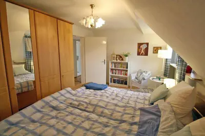 Ein Bett oder Betten in einem Zimmer der Unterkunft Ferienwohnung 11 mit großer Terrasse am Privatsee