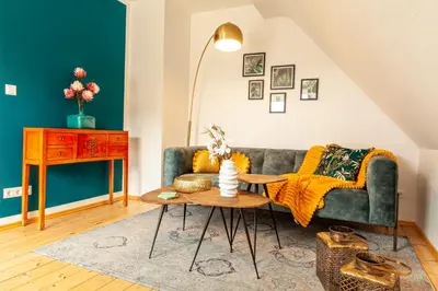 Ein Sitzbereich in der Unterkunft nidusROOMS: Art Déco Apartment nähe Heidelberg