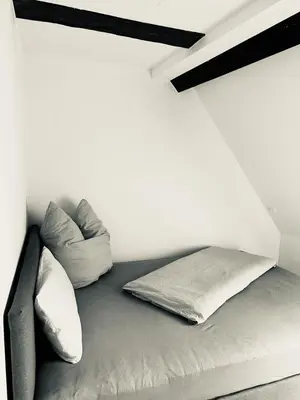 Ein Bett oder Betten in einem Zimmer der Unterkunft Ochsen-Durlach