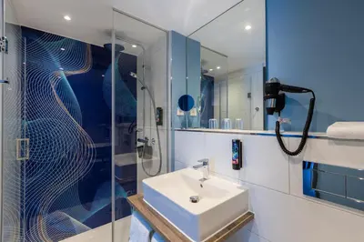 Ein Badezimmer in der Unterkunft Holiday Inn-the niu, Wave Karlsruhe Oststadt by IHG