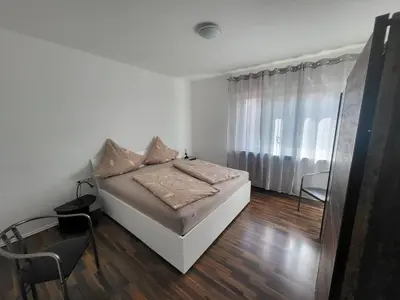 Ein Bett oder Betten in einem Zimmer der Unterkunft Ferienwohnung Braunshardt