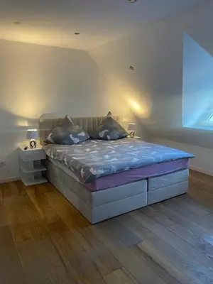 Ein Bett oder Betten in einem Zimmer der Unterkunft Luxuriöse Wohnung im Herzen von RLP