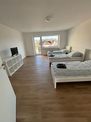 Ein Bett oder Betten in einem Zimmer der Unterkunft Monteurwohnungen im Weedenhof 55270 Zornheim