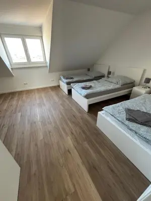 Ein Bett oder Betten in einem Zimmer der Unterkunft Monteurwohnungen im Weedenhof 55270 Zornheim